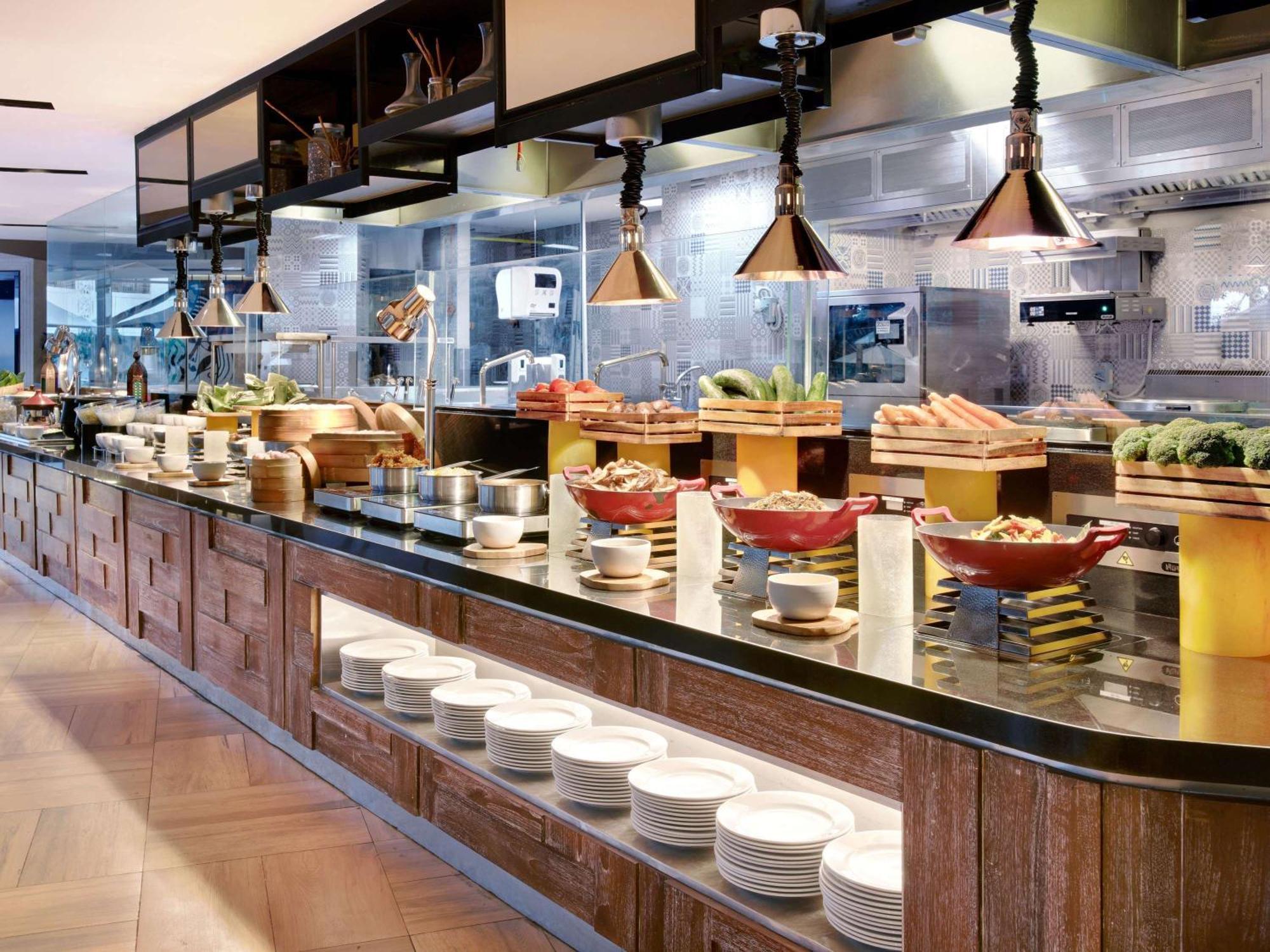 Grand Mercure Bali Seminyak Exterior photo A buffet at a restaurant